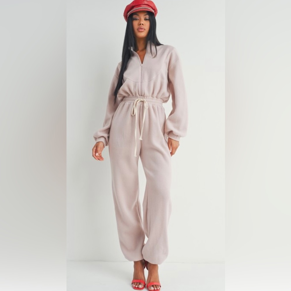 Blush colored warm jumpsuit drawstring waist and elastic ankle